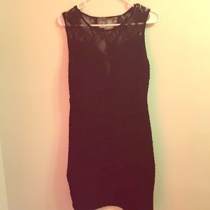 Sleeveless black dress with lace cut-out